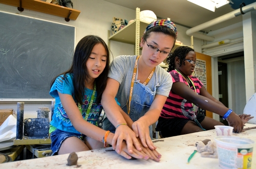 Rolling out some clay for coil pots in Ceramics class!