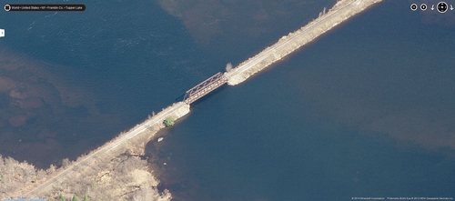 Aerial view of a bridge on the Corridor crossing Raquette Pond near Tupper Lake, NY